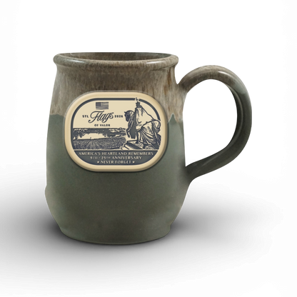 Green mug with a decorative label on a white background